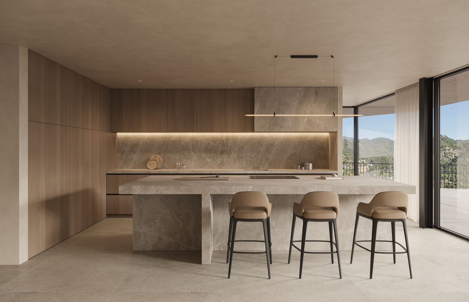 Modernt kök med köksö, barstolar och panoramautsikt över hav och berg.